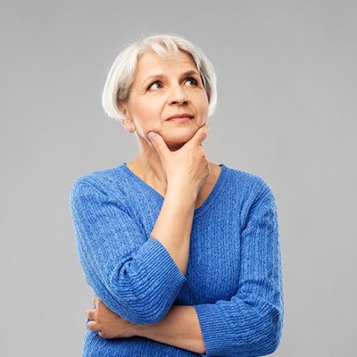 Woman looking off to the side in a questioning pose