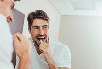 a man brushing his teeth