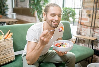 a man eating a salad